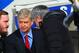Arsene Wenger looking less than impressed as Jose Mourinho shakes his hand