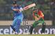 DHAKA, BANGLADESH - MARCH 28: Virat Kohli of India bats as Mushfiqur Rahim of Bangladesh looks on during the ICC World Twenty20 Bangladesh 2014 match between Bangladesh and India at Sher-e-Bangla Mirpur Stadium on March 28, 2014 in Dhaka, Bangladesh. (P