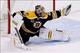 Boston goaltender Tuukka Rask makes a glove save against Chicago.