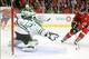 Blackhawks' forward Michal Handzus looks to score against Stars' goaltender Tim Thomas.