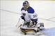 Blues' goaltender Ryan Miller makes a left pad save against the Flyers.