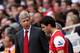 LONDON, ENGLAND - APRIL 02: Arsenal manager Arsene Wenger talks to Cesc Fabregas of Arsenal as he prepares to go on during the Barclays Premier League match between Arsenal and Blackburn Rovers at the Emirates Stadium on April 2, 2011 in London, England.