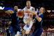 MEMPHIS, TN - MARCH 27: Scottie Wilbekin #5 of the Florida Gators drives to the basket as Norman Powell #4 and Travis Wear #24 of the UCLA Bruins defend during a regional semifinal of the 2014 NCAA Men's Basketball Tournament at the FedExForum on March 2