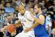 Mar 20, 2014; Spokane, WA, USA; Michigan State Spartans forward Adreian Payne (5) dribbles against Delaware Fightin Blue Hens forward Carl Baptiste (33) in the first half of a men's college basketball game during the second round of the 2014 NCAA Tourname