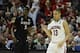 Mar 27, 2014; Anaheim, CA, USA; (Editor's Note: Caption Correction) Arizona Wildcats guard Nick Johnson (13) celebrates against San Diego State Aztecs forward Dwayne Polee II (5) during the second half in the semifinals of the west regional of the 2014 NC