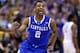 ST LOUIS, MO - MARCH 23: Aaron Harrison #2 of the Kentucky Wildcats celebrates after defeating the Wichita State Shockers 78 to 76 during the third round of the 2014 NCAA Men's Basketball Tournament at Scottrade Center on March 23, 2014 in St Louis, Miss