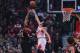 Mar 28, 2014; Chicago, IL, USA; Portland Trail Blazers forward LaMarcus Aldridge (12) shoots over Chicago Bulls center Joakim Noah (13) during the first quarter at the United Center. Mandatory Credit: Dennis Wierzbicki-USA TODAY Sports