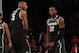 Mar 28, 2014; New York, NY, USA; Michigan State Spartans guard/forward Branden Dawson (22) reacts with Michigan State Spartans forward Alex Gauna (2) during the second half against the Virginia Cavaliers in the semifinals of the east regional of the 2014