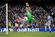 MANCHESTER, ENGLAND - DECEMBER 14: Costel Pantilimon of Manchester City fails to hold onto a cross during the Barclays Premier League match between Manchester City and Arsenal at Etihad Stadium on December 14, 2013 in Manchester, England. (Photo by Rich