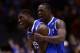 INDIANAPOLIS, IN - MARCH 28: Alex Poythress #22 and Julius Randle #30 of the Kentucky Wildcats celebrate defeating the Louisville Cardinals 74 to 69 during the regional semifinal of the 2014 NCAA Men's Basketball Tournament at Lucas Oil Stadium on March