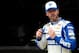 FONTANA, CA - MARCH 22: Jimmie Johnson, driver of the #48 Lowe's Chevrolet, walks through the garage area during practice for the NASCAR Sprint Cup Series Auto Club 400 at Auto Club Speedway on March 22, 2014 in Fontana, California. (Photo by Kevork Dja