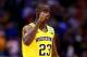 INDIANAPOLIS, IN - MARCH 28: Caris LeVert #23 of the Michigan Wolverines celebrates defeating the Tennessee Volunteers 73 to 71 during the regional semifinal of the 2014 NCAA Men's Basketball Tournament at Lucas Oil Stadium on March 28, 2014 in Indianapo