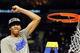 Apr 2, 2012; New Orleans, LA, USA; Kentucky Wildcats forward Anthony Davis waves to the crowd after cutting down a piece of the net after the finals of the 2012 NCAA men's basketball Final Four against the Kansas Jayhawks at the Mercedes-Benz Superdome. K