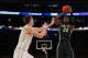 Mar 28, 2014; New York, NY, USA; Michigan State Spartans guard/forward Branden Dawson (22) shoots the ball against Virginia Cavaliers forward/center Mike Tobey (10) during the second half in the semifinals of the east regional of the 2014 NCAA Mens Basket