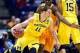 Mar 28, 2014; Indianapolis, IN, USA; Michigan Wolverines guard Nik Stauskas (11) controls the ball against the Tennessee Volunteers in the first half in the semifinals of the midwest regional of the 2014 NCAA Mens Basketball Championship tournament at Luc