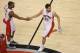 Feb 27, 2014; Toronto, Ontario, CAN; Toronto Raptors guard Greivis Vasquez (21) is congratulated by point guard Kyle Lowry (7) after scoring a basket against the Washington Wizards at Air Canada Centre. The Wizards beat the Raptors 134-129 in triple overt