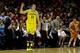 MILWAUKEE, WI - MARCH 22: Nik Stauskas #11 of the Michigan Wolverines reacts in the first half against the Texas Longhorns during the third round of the 2014 NCAA Men's Basketball Tournament at BMO Harris Bradley Center on March 22, 2014 in Milwaukee, Wi