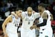 SPOKANE, WA - MARCH 22: Denzel Valentine #45 Adreian Payne #5, Keith Appling #11 and Branden Dawson #22 of the Michigan State Spartans celebrate in the second half of their 80 to 73 win over the Harvard Crimson during the Third Round of the 2014 NCAA Bas