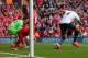 LIVERPOOL, ENGLAND - MARCH 30: Younes Kaboul of Tottenham Hotspur scores an own goal during the Barclays Premier League match between Liverpool and Tottenham Hotspur at Anfield on March 30, 2014 in Liverpool, England. (Photo by Alex Livesey/Getty Images