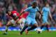 LONDON, ENGLAND - MARCH 29: Fernandinho of Manchester City and Mathieu Flamini of Arsenal compete for the ball during the Barclays Premier League match between Arsenal and Manchester City at Emirates Stadium on March 29, 2014 in London, England. (Photo