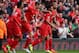 LIVERPOOL, ENGLAND - MARCH 30: Glen Johnson of Liverpool (R) and team-mate Raheem Sterling celebrate the first goal during the Barclays Premier League match between Liverpool and Tottenham Hotspur at Anfield on March 30, 2014 in Liverpool, England. (Pho
