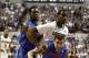 Dec 2, 2013; Storrs, CT, USA; Florida Gators guard Scottie Wilbekin (5) defends against Connecticut Huskies forward DeAndre Daniels (2) in the first half at Harry A. Gampel Pavilion. Mandatory Credit: David Butler II-USA TODAY Sports
