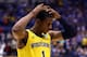INDIANAPOLIS, IN - MARCH 30: Glenn Robinson III #1 of the Michigan Wolverines reacts after being defeated by the Kentucky Wildcats 75 to 72 in the midwest regional final of the 2014 NCAA Men's Basketball Tournament at Lucas Oil Stadium on March 30, 2014
