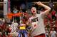 ANAHEIM, CA - MARCH 29: Frank Kaminsky #44 of the Wisconsin Badgers celebrates after he cuts down the net after defeating the Arizona Wildcats 64-63 in overtime during the West Regional Final of the 2014 NCAA Men's Basketball Tournament at the Honda Cent