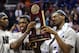 MEMPHIS, TN - MARCH 29: Casey Prather #24 and Will Yeguete #15 of the Florida Gators celebrate with the trophy after defeating the Dayton Flyers 62-52 in the south regional final of the 2014 NCAA Men's Basketball Tournament at the FedExForum on March 29,