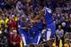 INDIANAPOLIS, IN - MARCH 30: Aaron Harrison #2 of the Kentucky Wildcats celebrates with teammates Julius Randle #30 and Dakari Johnson after defeating the Michigan Wolverines 75 to 72 in the midwest regional final of the 2014 NCAA Men's Basketball Tourna
