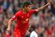 LIVERPOOL, ENGLAND - MARCH 30: Philippe Coutinho of Liverpool celebrates scoring the third goal during the Barclays Premier League match between Liverpool and Tottenham Hotspur at Anfield on March 30, 2014 in Liverpool, England. (Photo by Alex Livesey/G