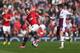 MANCHESTER, ENGLAND - MARCH 29: Ashley Westwood of Aston Villa competes with Juan Mata of Manchester United during the Barclays Premier League match between Manchester United and Aston Villa at Old Trafford on March 29, 2014 in Manchester, England. (Pho