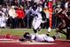 STARKVILLE, MS - NOVEMBER 28: Bo Wallace #14 of the Ole Miss Rebels fumbles the football during a game against the Mississippi State Bulldogs at Davis Wade Stadium on November 28, 2013 in Starkville, Mississippi. Mississippi State won the game 17-10. (