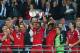 LONDON, ENGLAND - MAY 25: Jerome Boateng of Bayern Muenchen lifts the trophy in celebration alongside team mates after victory in the UEFA Champions League final match between Borussia Dortmund and FC Bayern Muenchen at Wembley Stadium on May 25, 2013 in