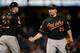 SAN FRANCISCO, CA - AUGUST 09: Catcher Matt Wieters #32 and pitcher Tommy Hunter #29 shake hands after a 5-2 win over the San Francisco Giants in 10 innings at AT&T Park on August 9, 2013 in San Francisco, California. (Photo by Thearon W. Henderson/Gett