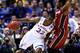 ST LOUIS, MO - MARCH 23: Andrew Wiggins #22 of the Kansas Jayhawks drives against Chasson Randle #5 of the Stanford Cardinal during the third round of the 2014 NCAA Men's Basketball Tournament at Scottrade Center on March 23, 2014 in St Louis, Missouri.