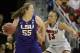 Mar 30, 2014; Louisville, KY, USA; LSU Tigers forward Theresa Plaisance (55) dribbles against Louisville Cardinals forward Cortnee Walton (13) in the semifinals of a women's college basketball game in the Louisville regional of the 2014 NCAA Tournament at