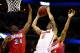 MEMPHIS, TN - MARCH 29: Scottie Wilbekin #5 of the Florida Gators goes to the basket as Jordan Sibert #24 and Devin Oliver #5 of the Dayton Flyers defend during the south regional final of the 2014 NCAA Men's Basketball Tournament at the FedExForum on Ma