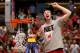 ANAHEIM, CA - MARCH 29: Frank Kaminsky #44 of the Wisconsin Badgers celebrates after he cuts down the net after defeating the Arizona Wildcats 64-63 in overtime during the West Regional Final of the 2014 NCAA Men's Basketball Tournament at the Honda Cent