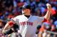 BALTIMORE, MD - MARCH 31: Starting pitcher Jon Lester #31 of the Boston Red Sox throws a pitch to a Baltimore Orioles batter during the first inning of Opening Day at Oriole Park at Camden Yards on March 31, 2014 in Baltimore, Maryland. (Photo by Rob Ca