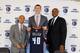 From left to right: GM Rich Cho, Cody Zeller and president of basketball operations Rod Higgins