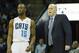 Mar 22, 2014; Charlotte, NC, USA; Charlotte Bobcats head coach Steve Clifford talks with guard Kemba Walker (15) during the first half against the Portland Trail Blazers at Time Warner Cable Arena. Mandatory Credit: Jeremy Brevard-USA TODAY Sports