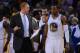 November 20, 2013; Oakland, CA, USA; Golden State Warriors assistant coach Brian Scalabrine (left) instructs small forward Andre Iguodala (9) during the fourth quarter against the Memphis Grizzlies at Oracle Arena. The Grizzlies defeated the Warriors 88-8