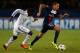 PARIS, FRANCE - NOVEMBER 05: Gregory van der Wiel of PSG is chased by Fabrice N'Sakala of Anderlecht during the UEFA Champions League Group C match between Paris Saint Germain and RSC Anderlecht at Parc des Princes on November 5, 2013 in Paris, France.