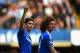 LONDON, ENGLAND - MARCH 22: Oscar of Chelsea celebrates scoring their fifth goal with David Luiz of Chelsea during the Barclays Premier League match between Chelsea and Arsenal at Stamford Bridge on March 22, 2014 in London, England. (Photo by Shaun Bot