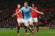 MANCHESTER, ENGLAND - MARCH 25: Edin Dzeko of Manchester City celebrates scoring the second goal during the Barclays Premier League match between Manchester United and Manchester City at Old Trafford on March 25, 2014 in Manchester, England. (Photo by A