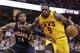Luol Deng driving on Paul George.