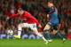 MANCHESTER, ENGLAND - APRIL 01: Toni Kroos of Bayern Muenchen marshalls Wayne Rooney of Manchester United during the UEFA Champions League Quarter Final first leg match between Manchester United and FC Bayern Muenchen at Old Trafford on April 1, 2014 in