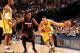 INDIANAPOLIS, IN - MARCH 26: Evan Turner #12 of the Indiana Pacers drives against Mario Chalmers #15 of the Miami Heat during a game on March 26, 2014 at Bankers Life Fieldhouse in Indianapolis, IN. NOTE TO USER: User expressly acknowledges and agrees th