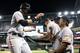 PHOENIX, AZ - MARCH 31: Brandon Belt #9 of the San Francisco Giants high fives assistant hitting coach Joe Lefebvre #5 after Belt hits a solo home run against the Arizona Diamondbacks during the sixth inning of the Opening Day MLB game at Chase Field on